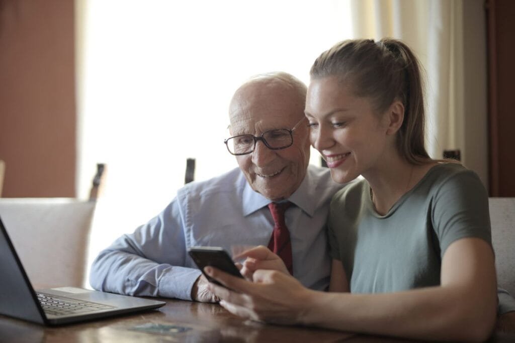 Home Care Local Citations: Senior-Care Directories That Bring Leads 2 A family member helping a senior search for home care options online, a key moment where home care local citations matter